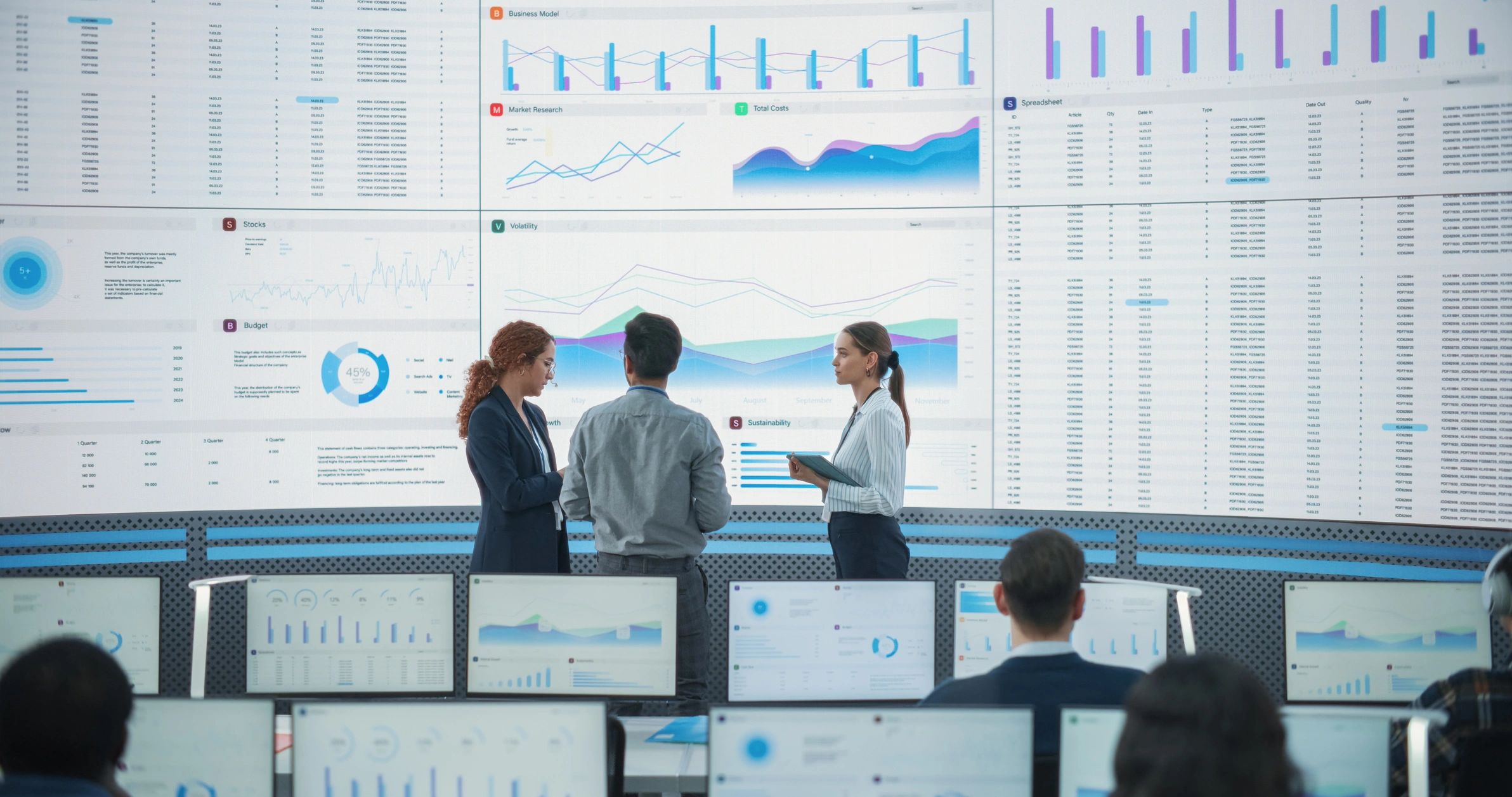 Technology team reviewing dashboards in a monitoring office
